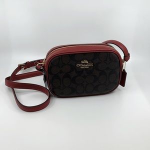 Coach camera bag. Brown with red strap.